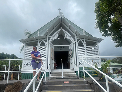 Four women in a one bathroom studio apartment, showered dressed and ready to go in record time.  First afternoon stop was The Sar of the Sea Painted Church first built from scrap wood by a Catholic priest in 1927. He and three other artists did the amazing artwork which contrasts good and evil.  The artwork has faded and peels over time. I found the choice of images to be less traditional and the most interesting part.  The church was moved in 1990 to the side of a road just before lava overtook its location.  It sat here until 1996 when it was moved to its current location.  The survival of this church has been through many members of the community and donations from visitors.