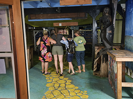 It was the first time I have ever tried fresh Kava (grown on the island). Being fresh, the kava was not gritty like dried root.  And maybe it was just a different strain but I didn't find it as relaxing as many. Heading out of the Kava Bar we discovered a yellow brick road and thought it would be fun to hook arms and skip on out like in the movies.  The most entertaining part of this oz adventure was the adorable little frog Marion found on the way out.  As she excitedly extended her arms to catch the frog, Laura and Brooke stepped back and silently watched when she recoiled at the discovery that her handsome frog was actually a cockroach.